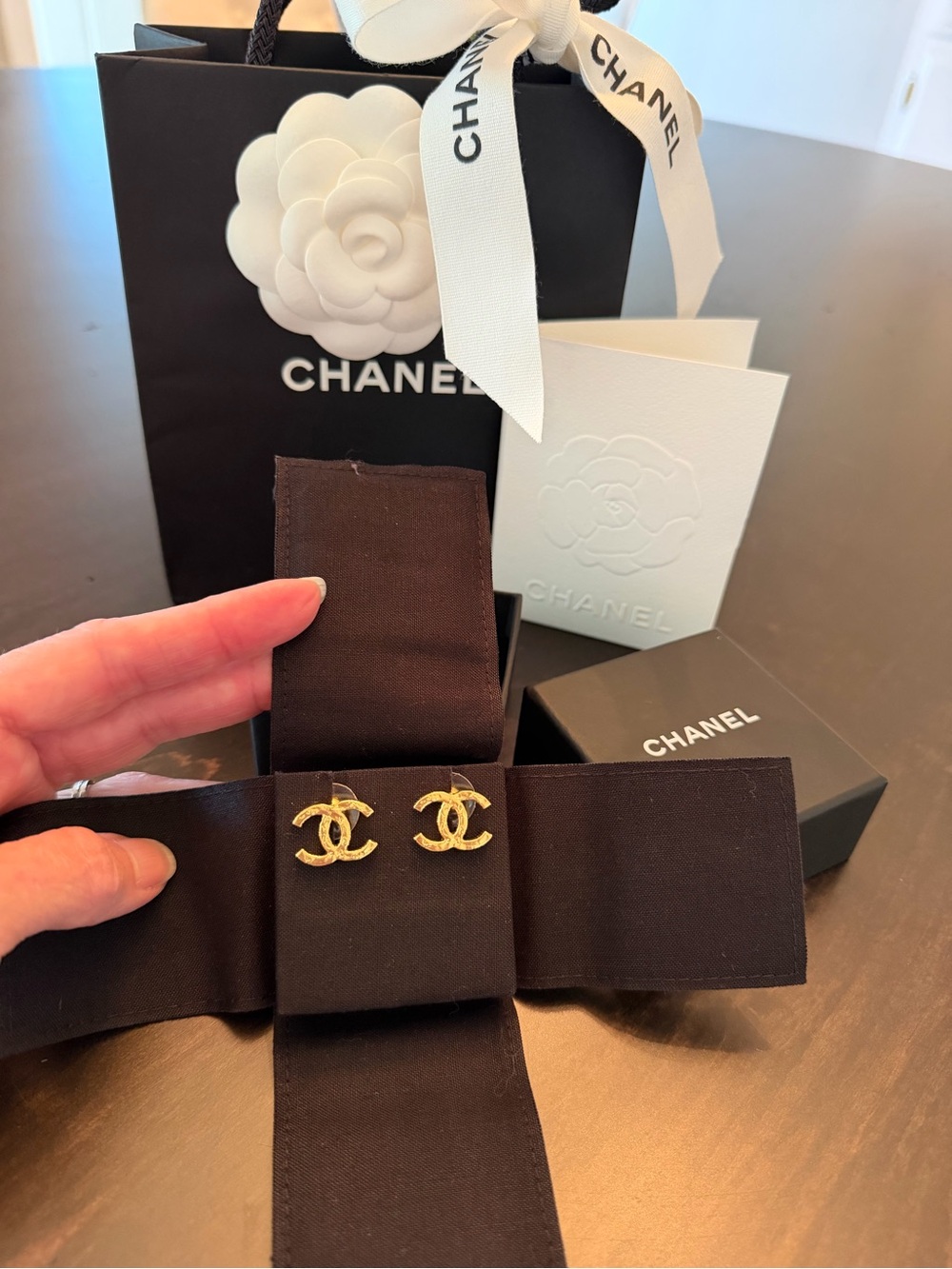 CHANEL Gold CC earrings.